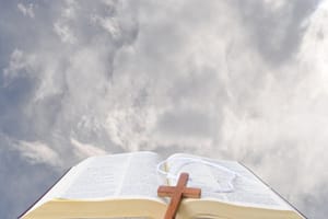 Vision of the bible in clouds being presented to the world Bible in clouds